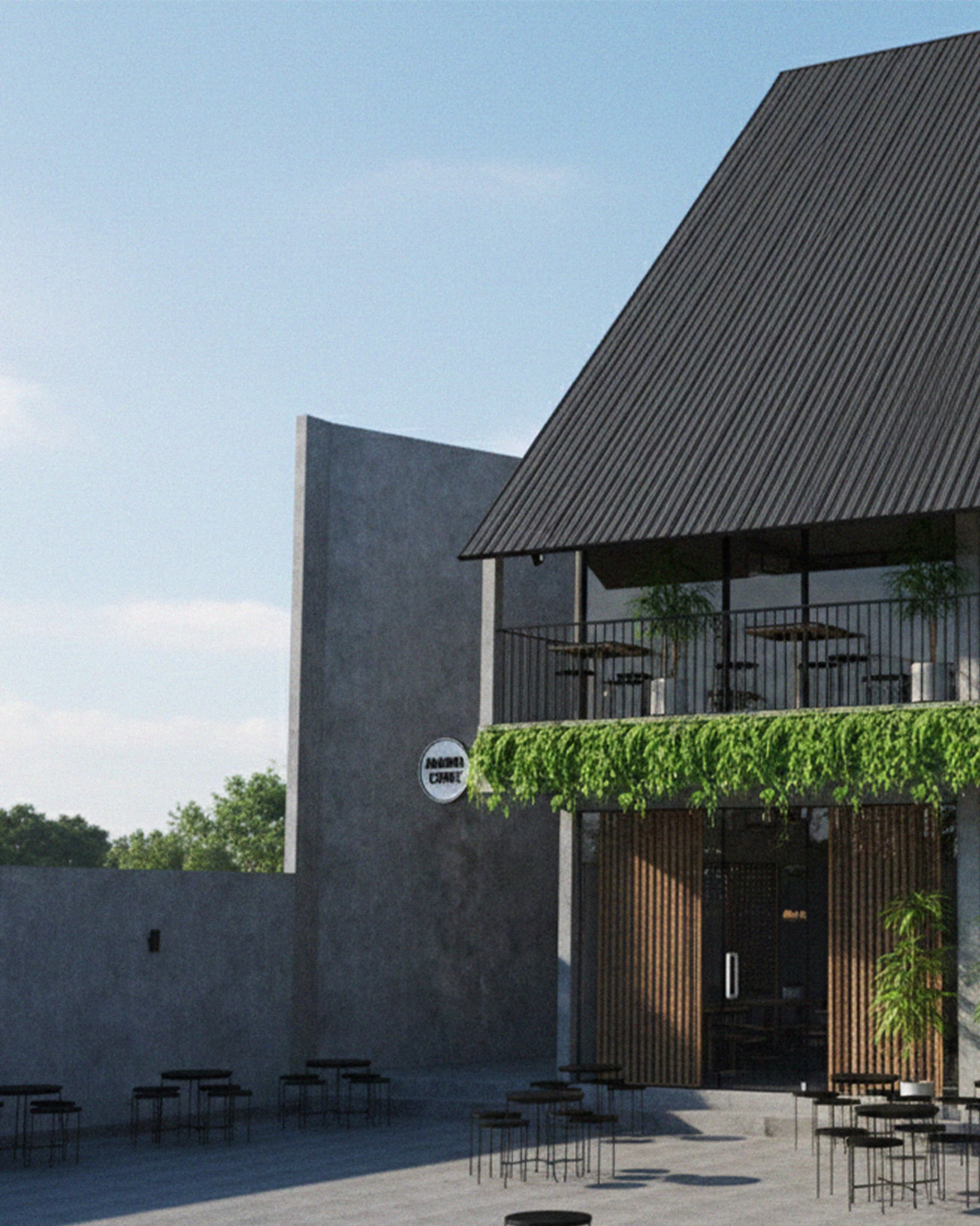 Amadya storefront with a dark corrugated roof, hanging greenery along the fascia and an open terrace below.